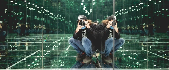 A visitor in a mirrored space