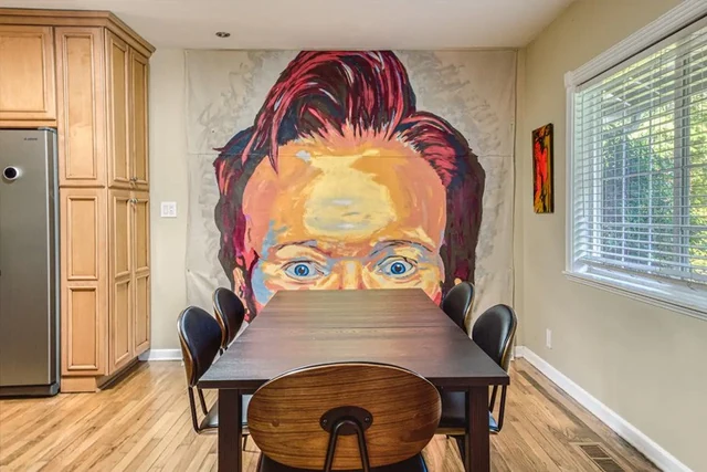 OMG! House · portrait mural and dining area